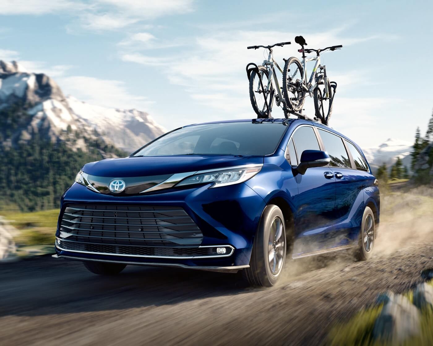 2022 Toyota Sienna hybrid with bikes on the roof, reliable minivan ideal for families.